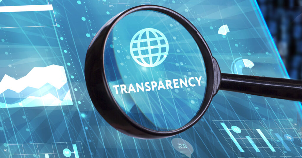 magnifying glass over the word transparency and the world symbol on a blue panel background