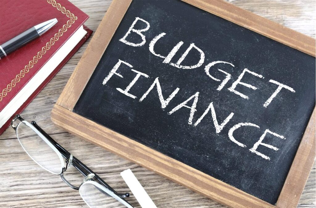 image with the words “budget finance” written on a blackboard