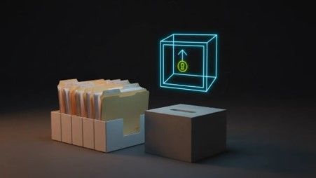 A filing box of paper folders next to a dark box with a slot, above which floats a glowing blue wireframe cube with a green padlock symbol
